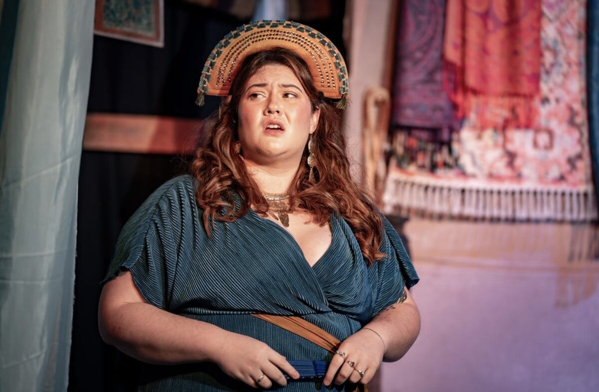 Sarah McNally performing on stage in costume